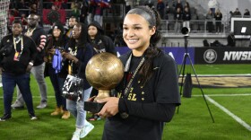 FILE - Portland Thorns FC forward Sophia Smith holds the MVP trophy after the NWSL championship soccer match against the Kansas City Current, Saturday, Oct. 29, 2022, in Washington. Forward Sophia Smith was named the U.S. Soccer Female Player of the Year on Friday, Jan. 6, 2023, after leading the national team with 11 goals and starting in a team-high 17 matches.