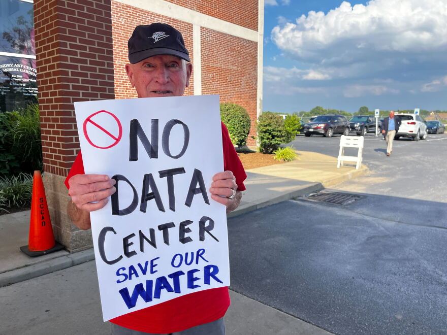 Charles Cross stands outside an open house about data centers in St. Charles, Missouri, on Aug. 13, 2026. Cross lives near the site of a proposed data center in St. Charles and does not want to see it built.