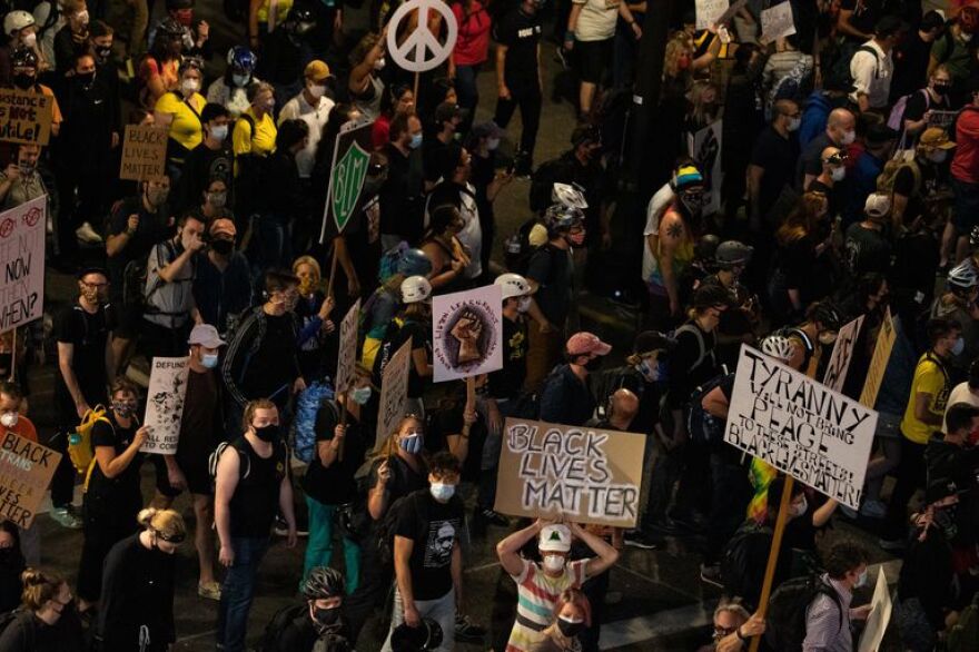 A crowd marching in downtown Portland, Ore., July 25, 2020.