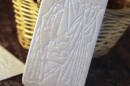 The <em>oplatek</em>, embossed with a Christmas scene, is shared among family members before Christmas Eve dinner.