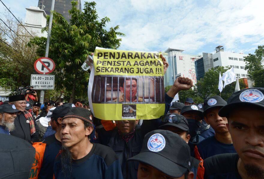 Indonesian Muslims demonstrate on Dec. 13, 2016, outside the court where Jakarta's governor, Basuki Tjahaja Purnama, is on trial for blasphemy. His allegedly blasphemous remarks sparked massive rallies against him in November and December.