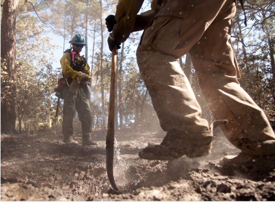 Firefighters extinguish wildfire hotspots in Bastrop. The 2011 Labor Day fires affected homes in Bastrop, Smithville and Steiner Ranch.