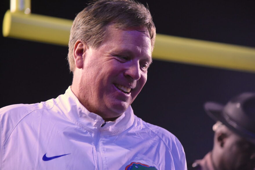 Florida head coach Jim McElwain smiles going into the locker room at halftime with his team up 34-13.