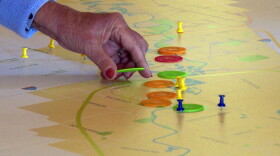 Residents near Carmel placed chips along a map of the river to show what places they think should be preserved (green), enhanced (orange), left alone (blue), or if the designers should develop an new destination (red).