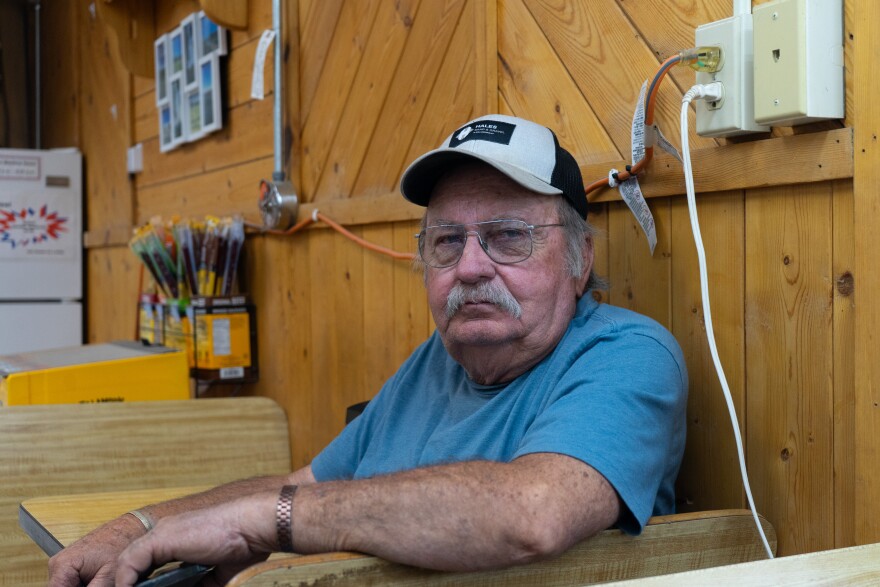 Greg Pearson sits at a gas station table in Junction and shares his firsthand experience fighting the Cottonwood Fire that’s burning across Beaver and Piute counties, June 30, 2026.