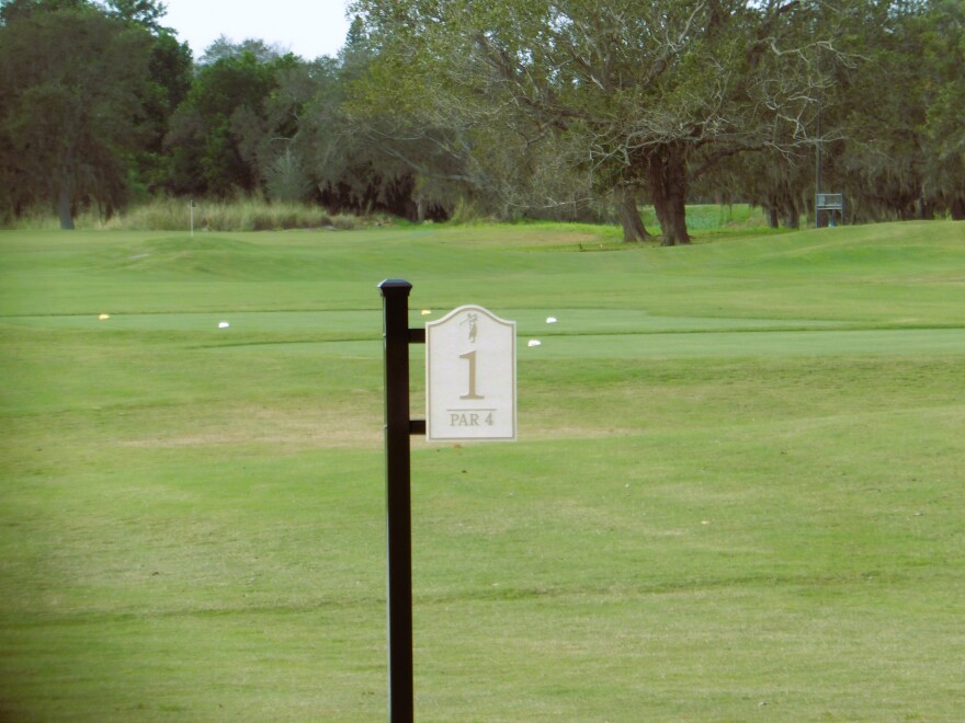 Hole 1 sign on a golf course