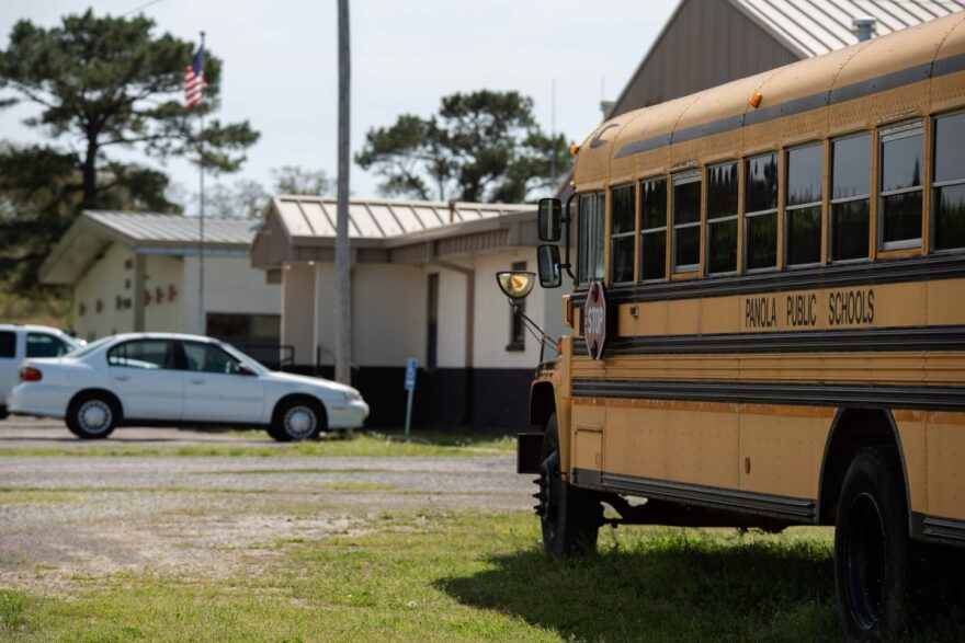 A school bus is seen parked in front of Panola High School in southeast Oklahoma. 