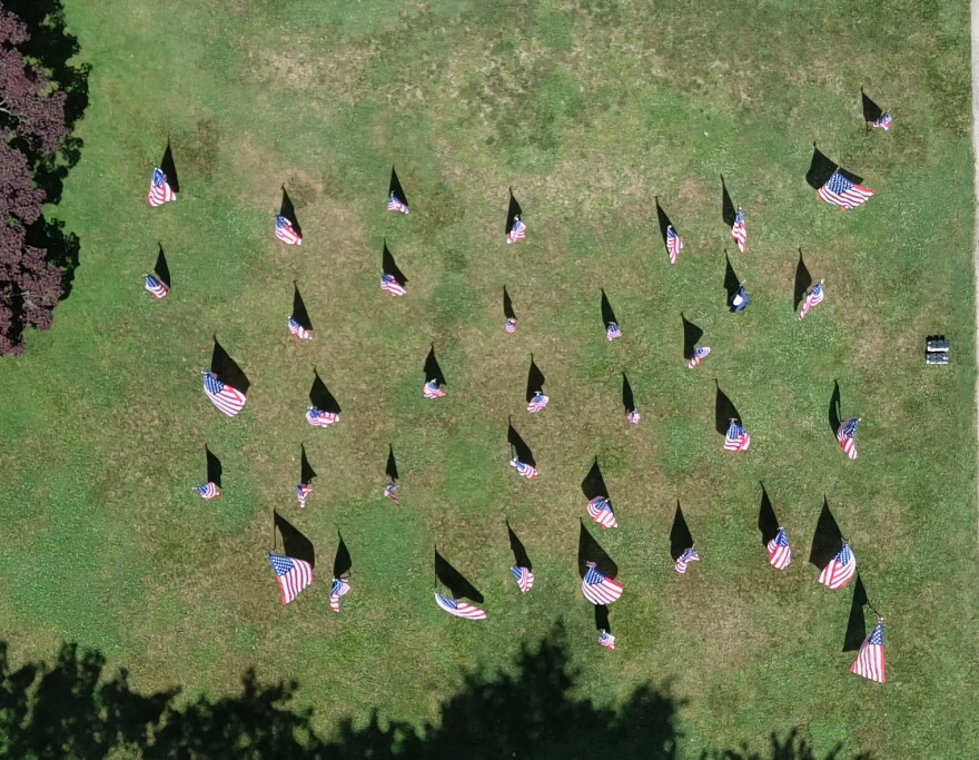 This image, provided by Luzerne County, shows the patriotic flag display on the county courthouse's south lawn prior to several flags being stolen. County Manager Romilda Crocamo said the display was shaped like the outline of the United States, with a county flag (seen at upper right) placed where Luzerne County sits.