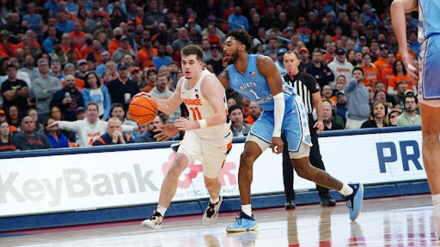 Syracuse’s Joe Girard III (11, White) drives to the lane during a 72-68 loss to North Carolina on January 24, 2023.