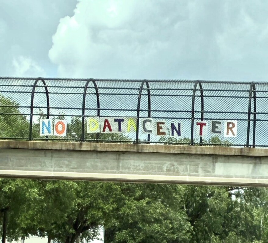 A homemade sign protesting the possible data center seen in Pensacola.