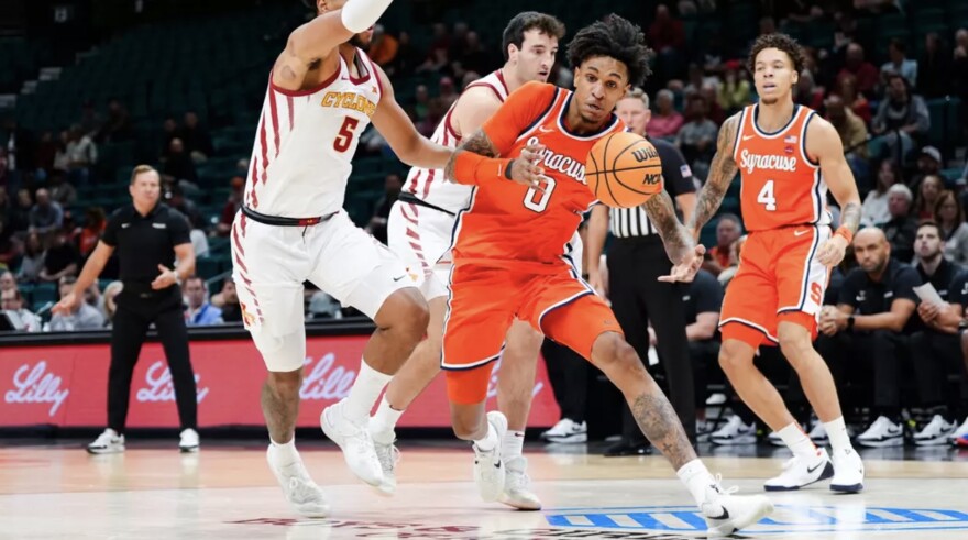 Sadiq White (0, Orange) knifes his way through the lane against Iowa State