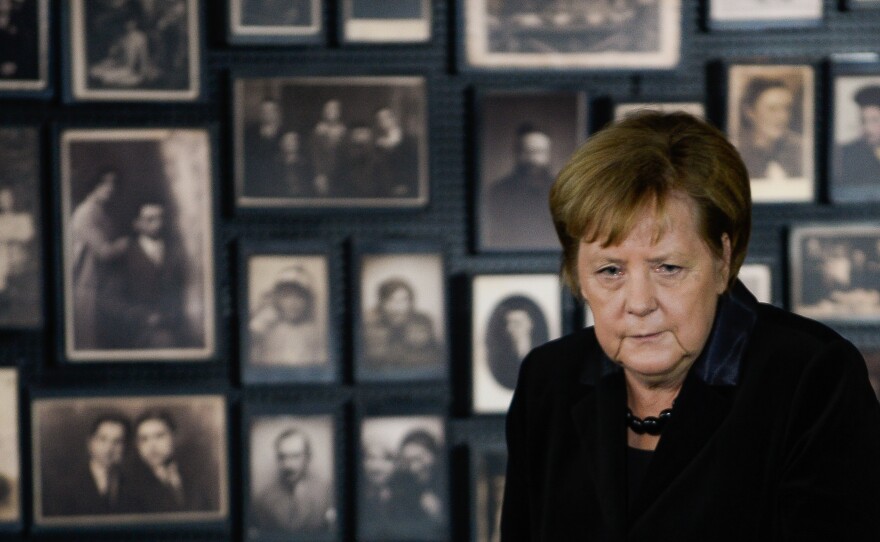 German Chancellor Angela Merkel spoke to the media Friday during an event marking the 10th anniversary of Auschwitz Foundation. During the address, she stood in front of the portraits of Jews imprisoned and killed at the death camp.