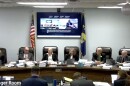 Montana Public Service Commissioner Brad Molnar sits on the far right at a hearing this week considering the merger between NorthWestern Energy and Black Hills