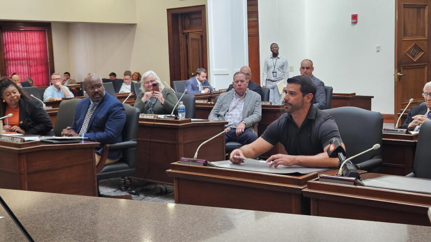 16-year Air Force veteran Garrett Sokolowski, front, voices support for a disabled veterans property tax exemption during Erie County Legislature's Oct. 8 meeting.
