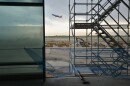 A Southwest Airlines passenger jet takes off from KCI on Tuesday afternoon as seen from what will be part of concourse B at the new terminal. Part of the glass enclosure at left is an example of much of the construction at the facility where natural light will stream in with abundance.