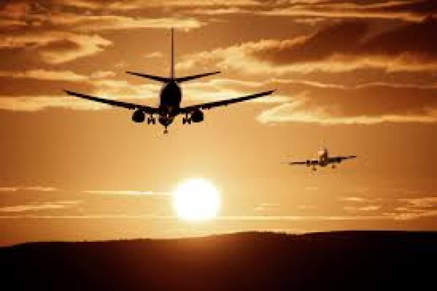 Picture of airplane in yellow sky