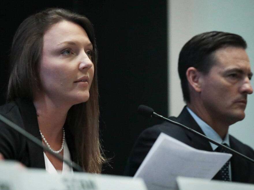 Courtney Wild (left), joined by her attorney Brad Edwards, reads a statement during a news conference, calling on victims of Jeffrey Epstein to contact the FBI or lawyers with their information in New York, Tuesday.