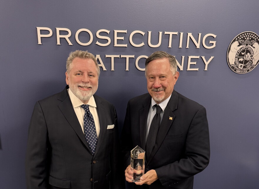 Platte County prosecutor Eric Zahnd, left, receives the Distinguished Prosecutor Award from the National District Attorneys Association in 2025. 