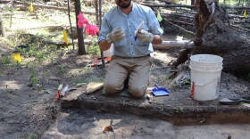 Southern Oregon University's Keoni Diacamos at work on July 21 excavating the site of a home in the vanished company town that once surrounded the Baker White Pine Mill.