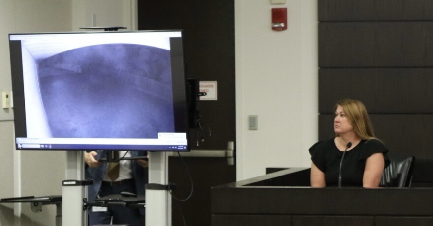 Brittani Powell testifies Wednesday as footage from a security camera at her home is displayed in court. Powell lived near the property where Christin Cassels was killed in 2017, and the recording captured audio of the shooting. (Katie Klaiber/WUFT News)