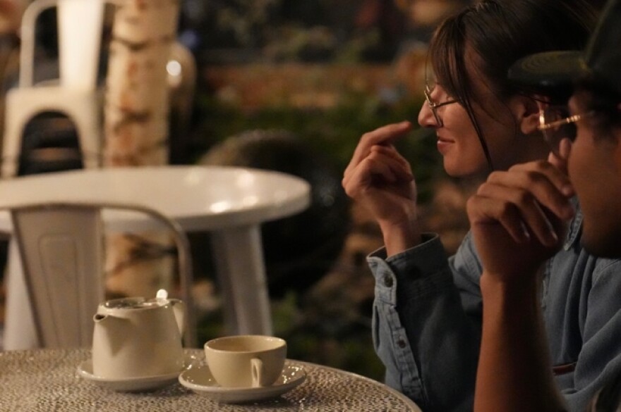 Taylor Fahey practices her ASL with a pot of tea at Trident