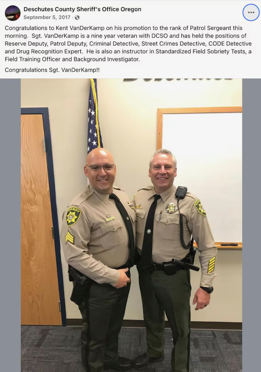 Two law enforcement officers shake hands in a social media post.