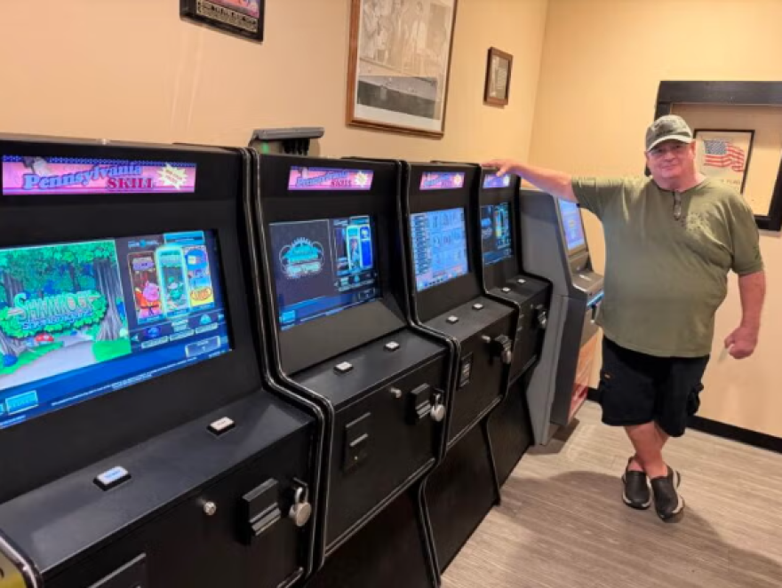 Pat McMullen, president of the Knights of Columbus Regina Coeli Home Association in Northeast Philadelphia, stands next to skill game terminals in the organization's bar.