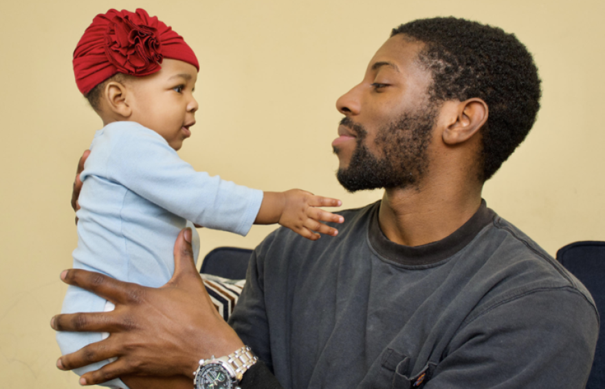Trevon Robinson, 25, photographed with his 6 month old daughter Zaria, is a recent graduate of the Fathers & Families Support Center.