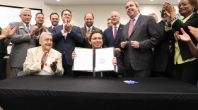  Governor Ron DeSantis signs SB 168: Federal Immigration Enforcement in June 2019 at the Okaloosa County Commissioners meeting. The bill prohibits state and local governments from having sanctuary policies in effect and requires such entities to support and cooperate with federal immigration enforcement.