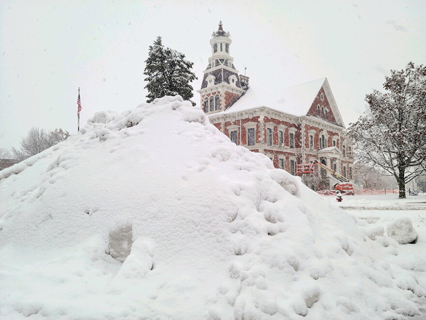 Snow is piled on the courthouse square in Macomb after the snowstorm earlier this week. More snow, possibly freezing rain, and much colder temperatures are on the way.