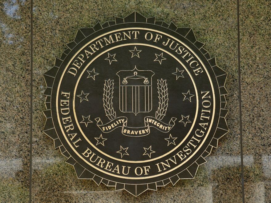 The FBI seal is seen outside the headquarters building in Washington, D.C. Under current federal law, all licensed gun dealers must contact the National Instant Criminal Background Check System (NICS) run by the FBI before making a sale.