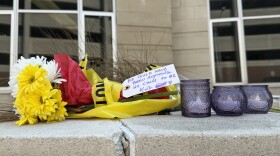 Candles and flowers were outside Constant Hall Friday in memory of Lt. Col. Brandon Shah. A note attached to the flowers read: "He could have been anything. He chose to be kind."