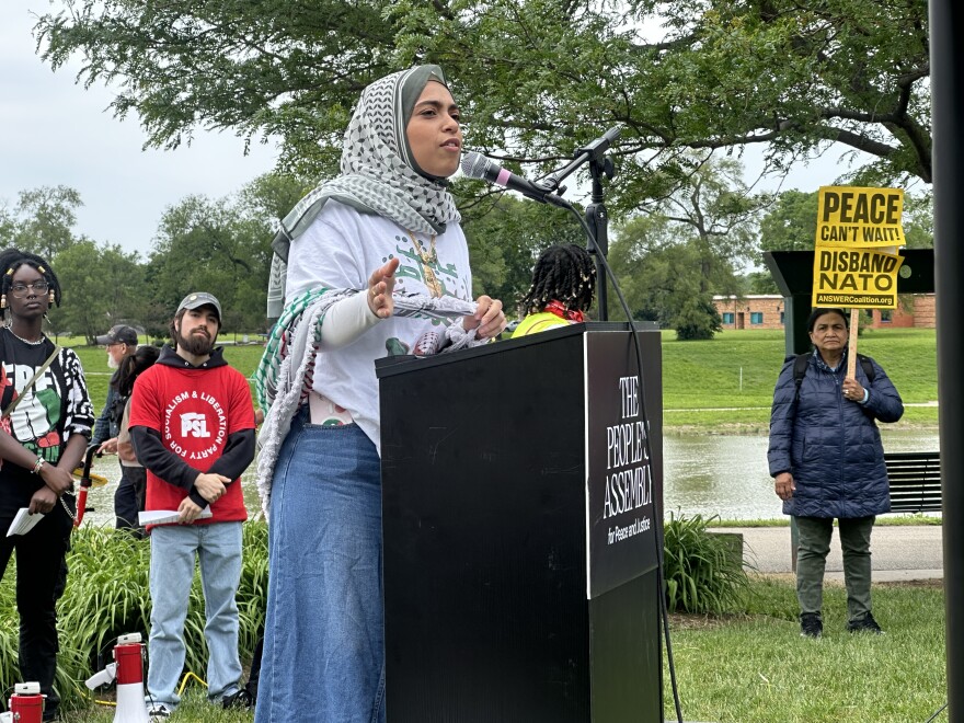 Image, woman talking at podium.