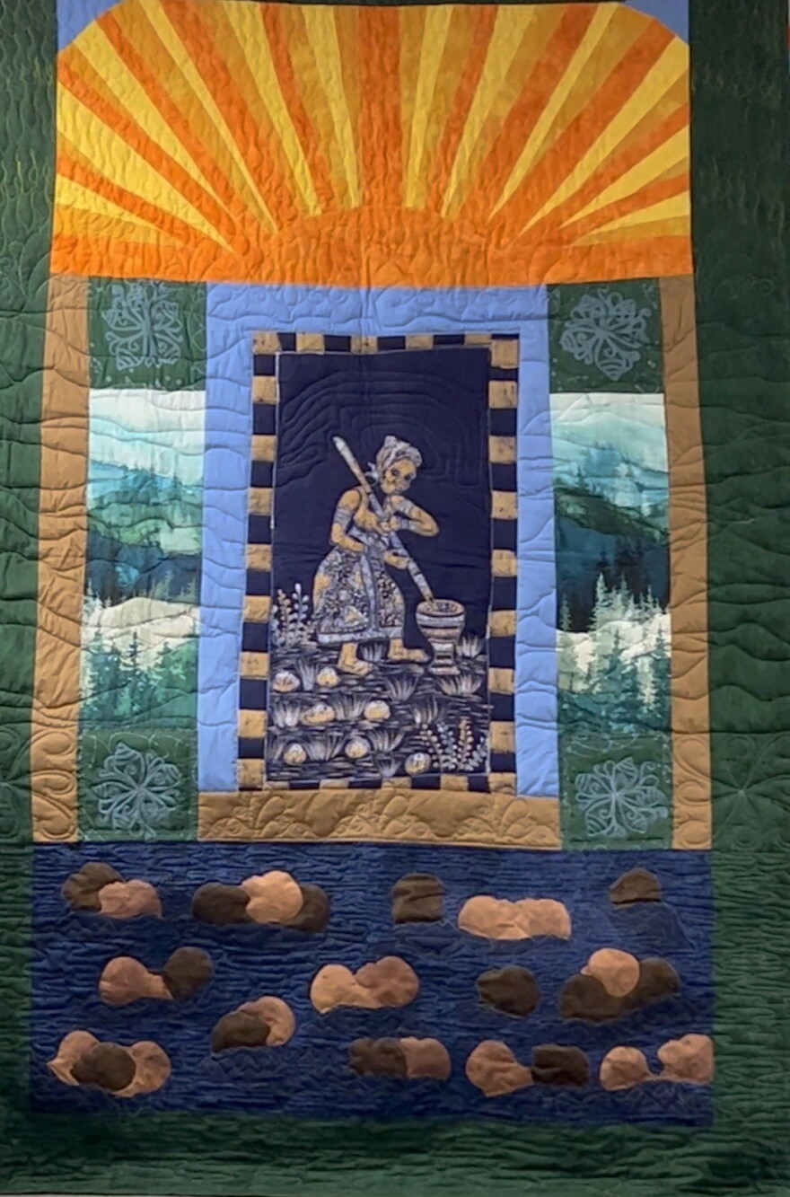 The first quilt made by the Southeast Kentucky African American Museum and Cultural Center's Stories behind the Quilt workshop featured a sunrise and Lead Researcher Sandra Jones interpretation of a painting of slaves thrown into the ocean she had seen at a museum in Birmingham, Alabama.