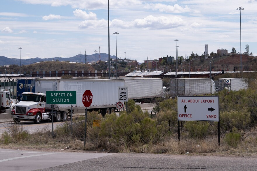 Trucks idle in traffic at the Nogales port of entry.