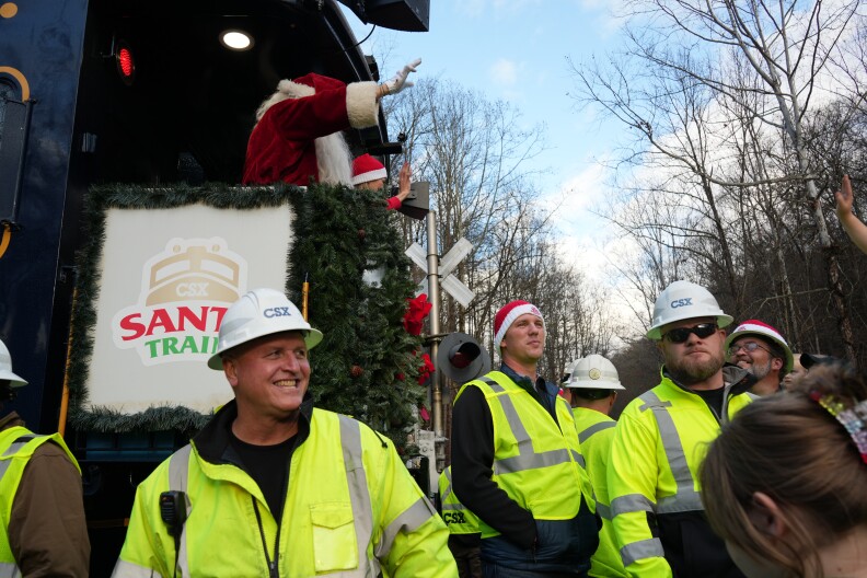 CSX Workers guard Santa during the annual Santa Train event