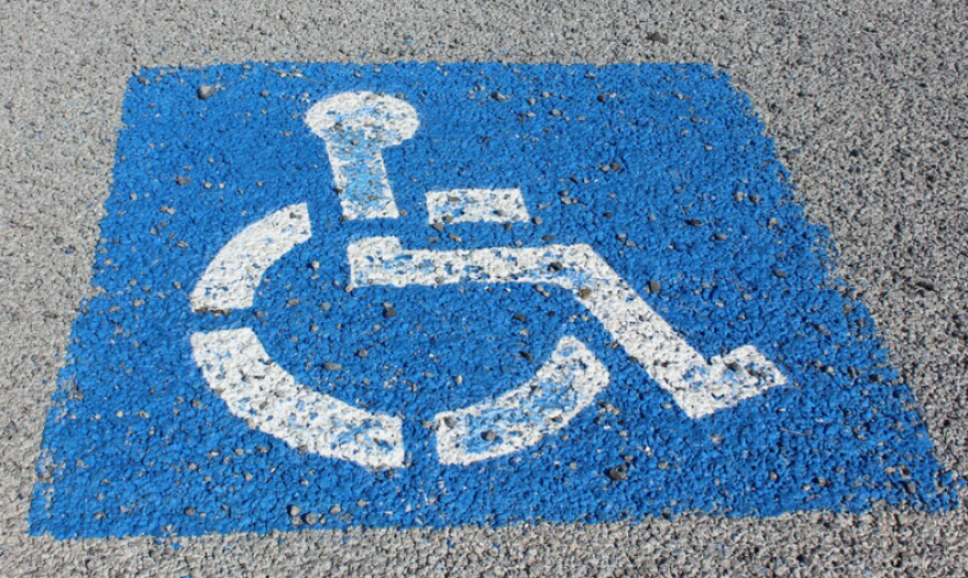A handicap parking sign on a parking space