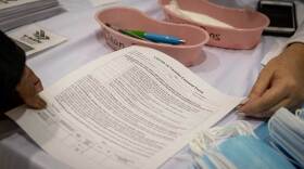 Tulane University staff members are given a COVID-19 vaccine consent form to fill out prior to receiving their first dose.