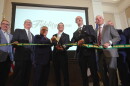 Daniel J. Santaniello, Fidelity Bank President and Chief Executive Officer, cuts a ribbon to open the bank's new corporate headquarters alongside Pennsylvania Governor Josh Shapiro and other bank and elected officials.
