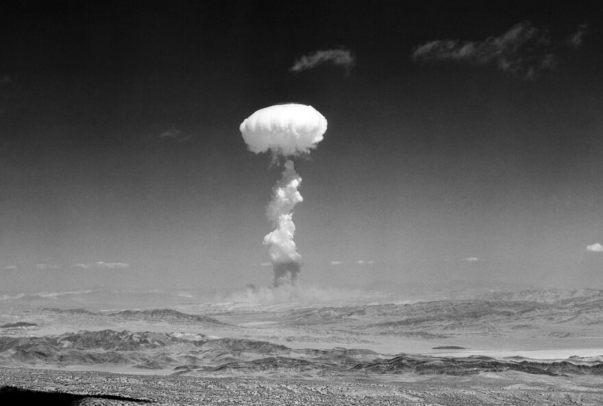 FILE - In this April 22, 1952 file photo, a gigantic pillar of smoke with the familiar mushroom top climbs above Yucca Flat, Nev., during nuclear test detonation.