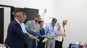 Governor Andy Beshear, second from left, Lexington-Fayette Urban County council member Hil Boone, Lexington Mayor Linda Gorton and others join other local and industry officials in a ribbon cutting ceremony for Holler Cannabis Company on August 21, 2026. Holler Cannabis Co. is a medical cannabis cultivator, licensed to grow medical cannabis for the burgeoning Kentucky industry.