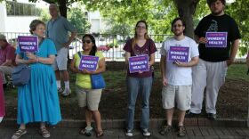 Protesters take a stand for abortion and women's rights at a Moral Mondays protest.