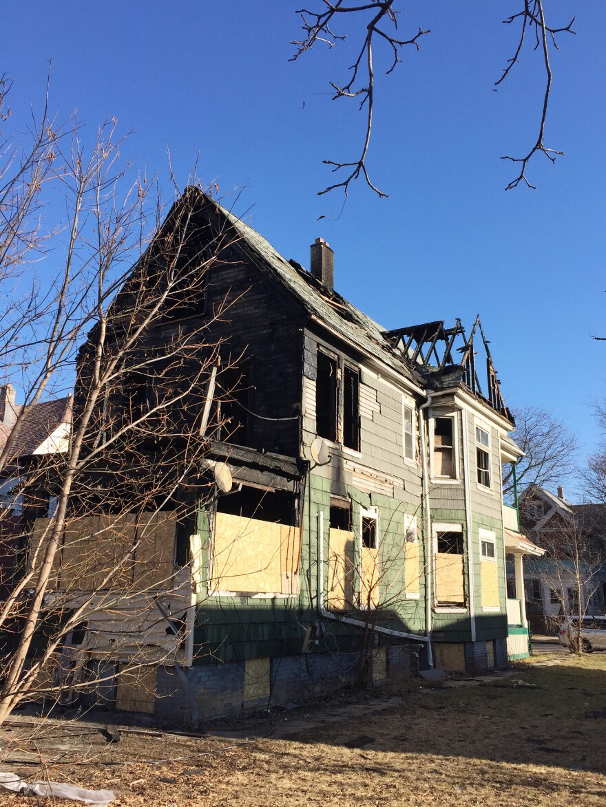 Some abandoned homes have been burned out and are waiting to be torn down.