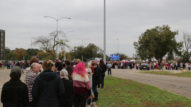 The line of people hoping to get into President Donald Trump's Lubbock rally continued to grow as the first speakers were shown on a large screen at the entrance of the event.