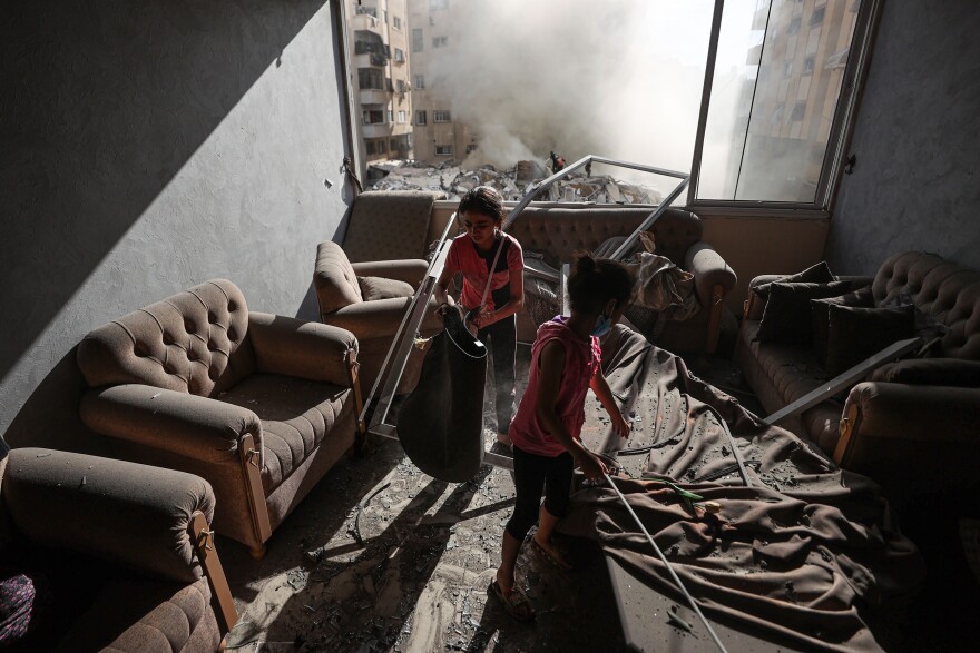 Children are seen in a destroyed house after Israeli attacks in Gaza City.