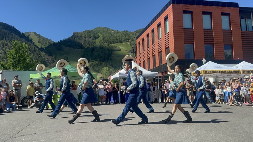 Folklórico dancers tip their hats while performing at Aspen’s farmer’s market during the Mallfest 50 Art Parade on June 27, 2026.