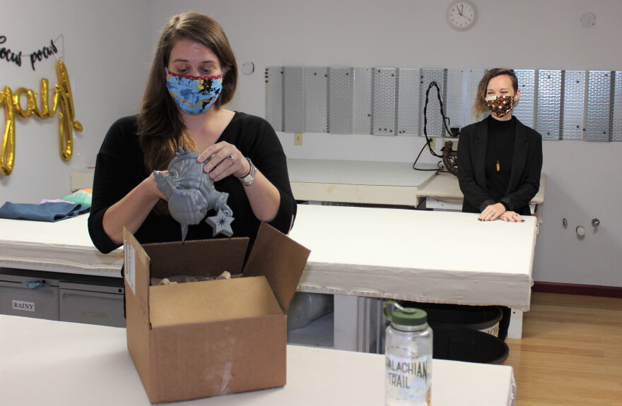 Abbi Houson (left) and Rainy Edwards stay socially distant while working on custom projects.