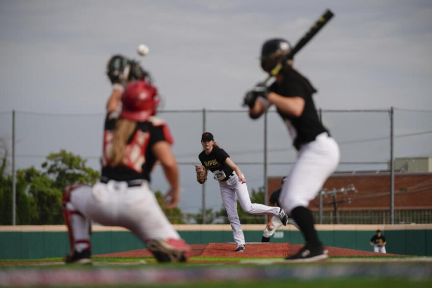 Juliette Kladko, center, pitches during the third day of tryouts for the Women's Professional Baseball League, Sunday, Aug. 24, 2025, at the Washington Nationals Youth Baseball Academy in Washington. (Julia Demaree Nikhinson/AP)