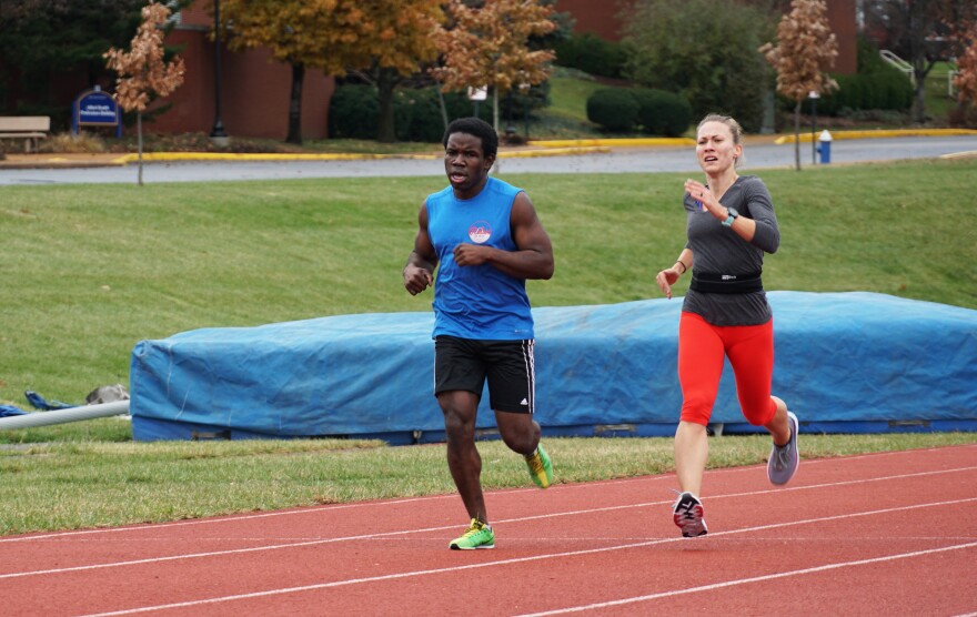 Nick Silver and Liz Houghton run 200-meter sprints at the St. Louis University Track on December 1, 2019.