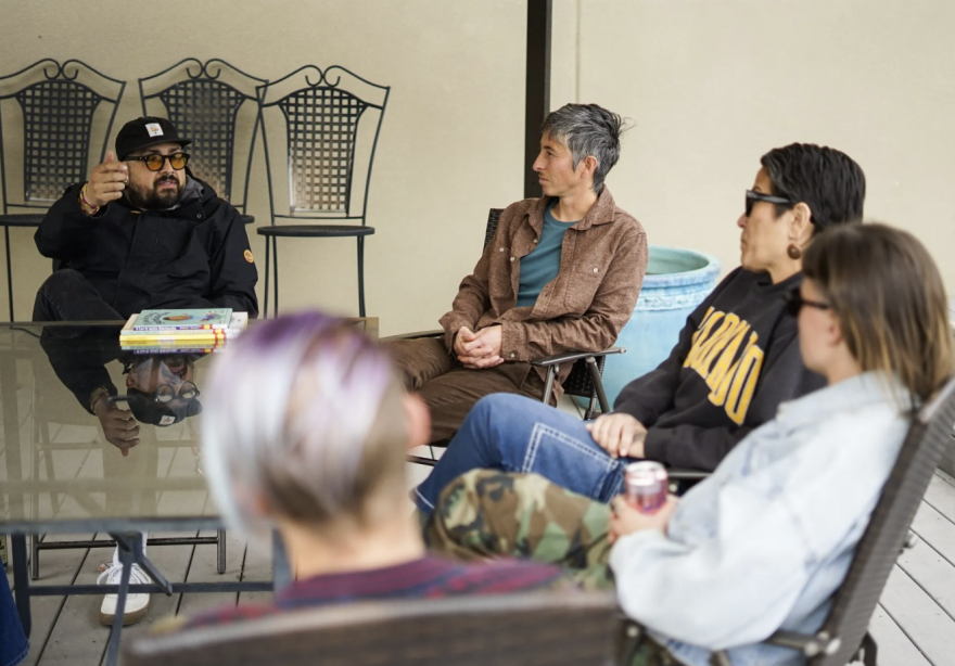 Enrique Orozco-Perez, co-executive director of Compañeros, far left, meets with volunteers, clockwise from top, M Carrasco-Songer, Tirzah Camacho, Spenser Snarr, and Jay Conlon while speaking with a reporter in Durango on Monday, April 6, 2026.
